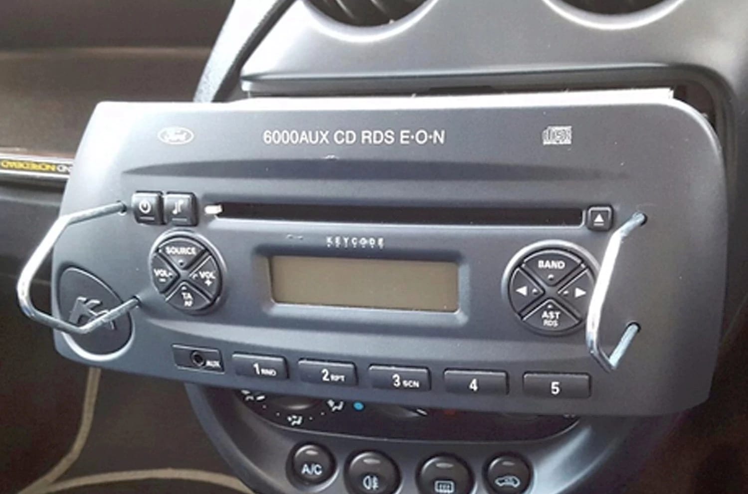 Removing a standard radio with radio removal keys